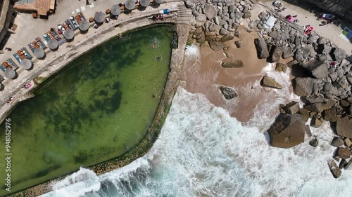 Azenhas do Mar -A bird s eye view of a natural pool on a rocky coastline with turquoise waves crashing on the shore coastallife naturalpool oceanviews aerialphotography