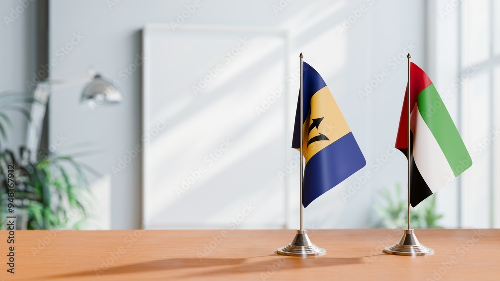 FLAGS OF BARBADOS AND UAE ON TABLE FLAGS OF BARBADOS AND UAE ON TABLE