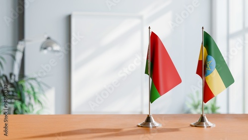 FLAGS OF BELARUS AND ETHIOPIA ON TABLE photo