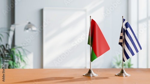 FLAGS OF BELARUS AND GREECE ON TABLE photo