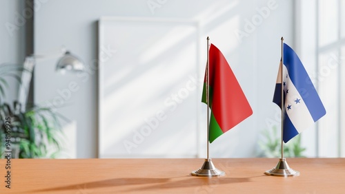 FLAGS OF BELARUS AND HONDURAS ON TABLE photo