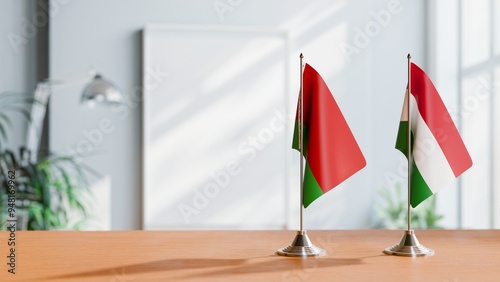 FLAGS OF BELARUS AND HUNGARY ON TABLE photo