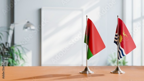 FLAGS OF BELARUS AND KIRIBATI ON TABLE photo