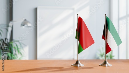 FLAGS OF BELARUS AND KUWAIT ON TABLE photo