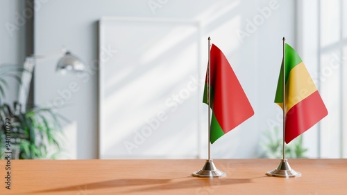 FLAGS OF BELARUS AND MALI ON TABLE photo