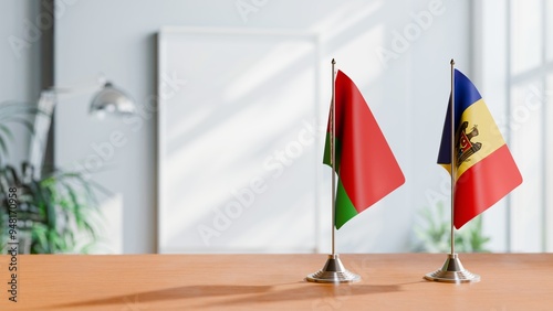 FLAGS OF BELARUS AND MOLDOVA ON TABLE photo