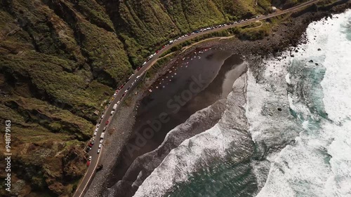 Aerial view of the beautiful Playa de Benijo beach with rugged cliffs and serene ocean waves, Benijo, Tenerife, Spain. photo