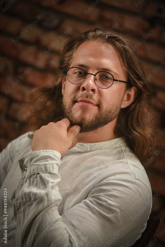 Man portrait in the glasses and shirt close up.