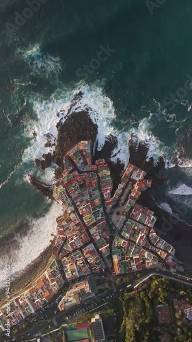 Aerial view of picturesque Charcones Punta Brava with beautiful coastal buildings and crashing waves, Puerto de la Cruz, Spain. photo