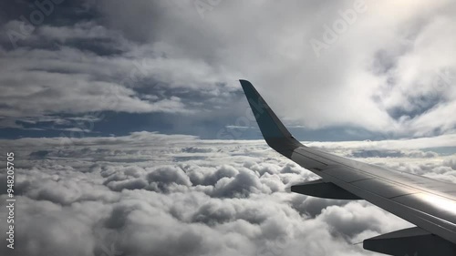 aerial footage of a plane flying through clouds in the rain