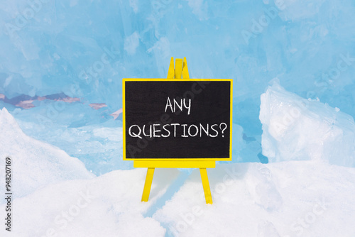 Any questions symbol. Concept words Any questions on beautiful yellow blackboard. Beautiful forest snow blue sky background. Business and Any questions Q and A concept, copy space. photo