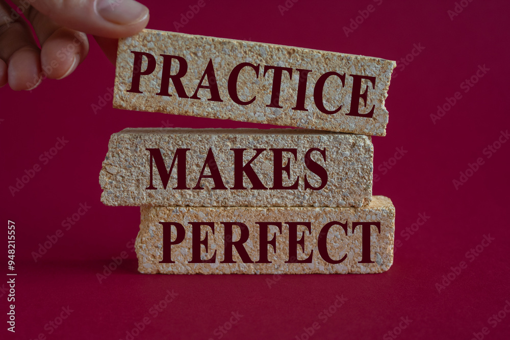 Practice makes perfect symbol. Brick blocks with words Practice makes perfect on beautiful pink background. Businessman hand. Business practice makes perfect concept.