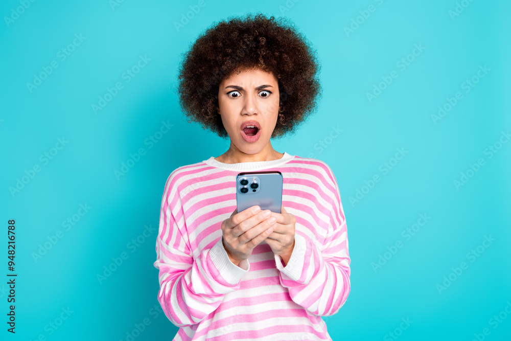 Photo of shocked attractive lady dressed pink pullover getting sms modern gadget empty space isolated turquoise color background Photo of shocked attractive lady dressed pink pullover getting sms modern gadget empty space isolated turquoise color background