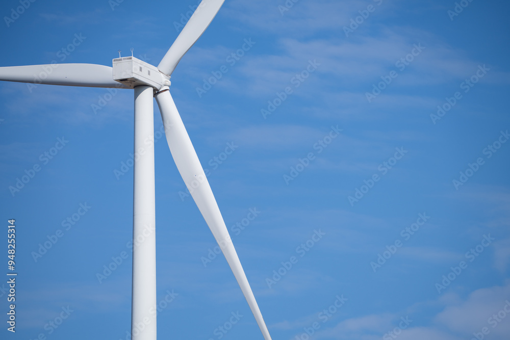 Wind turbines against blue sky, Wind energy. Wind power. Sustainable, renewable energy. Wind turbine generate electricity. Sustainable resources. Green technology for energy sustainability. Wind turbines against blue sky, Wind energy. Wind power. Sustainable, renewable energy. Wind turbine generate electricity. Sustainable resources. Green technology for energy sustainability.