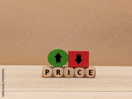 up and down arrow symbols, and the word Price on a wooden cube. the concept of changes in price increases and decreases . business finance