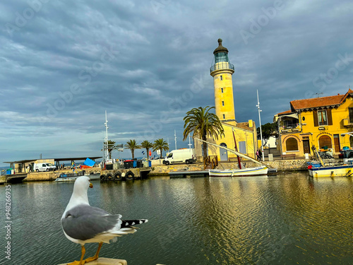 Camargue seaport, France with a cloudy sky and a seagull looking aroun photo