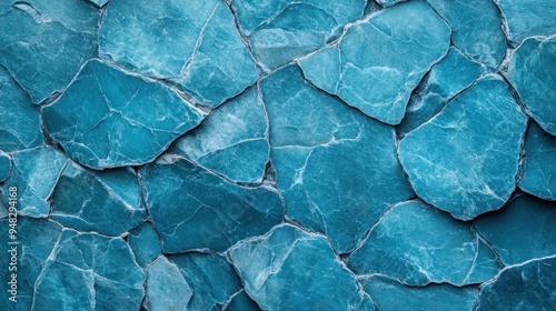 A striking image featuring the intricate pattern of blue stone, showcasing interlocking jagged surfaces and fine details, conveying depth and texture.