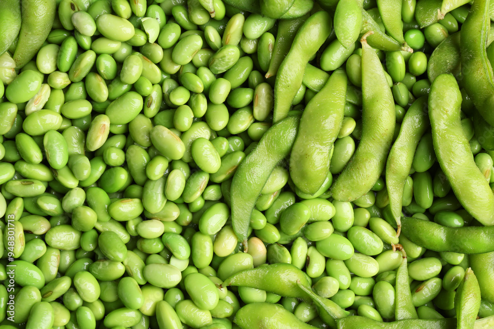 Fresh edamame beans and pods as background, top view Fresh edamame beans and pods as background, top view
