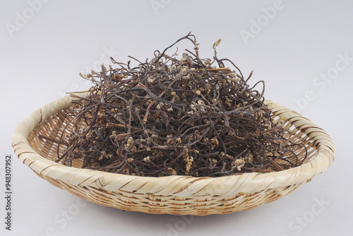 Close-up of stacked dried bracken on a bamboo basket, South Korea