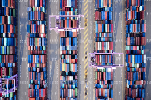 Songdo New City, Songdo-dong, Yeonsu-gu, Incheon, South Korea - September 12, 2021: Aerial and top angle view of cranes and stacked containers at Incheon New Port photo