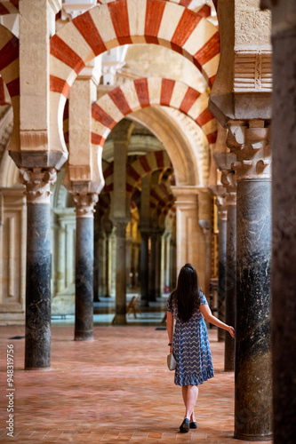 woman in the interior of the cathedral of Cordoba Spain