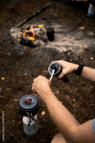 camping coffee break with manual grinder