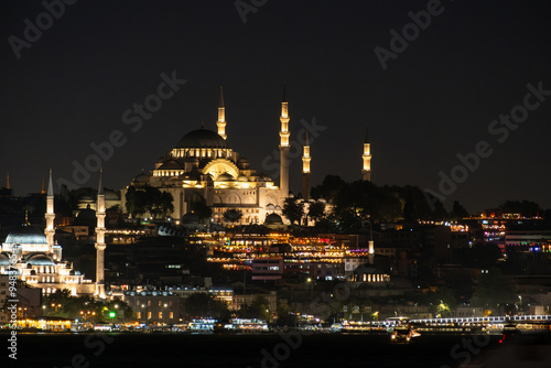 Istanbul skyline with Eminonu district and Suleymaniye mosque as seen across the Golden Horn at night