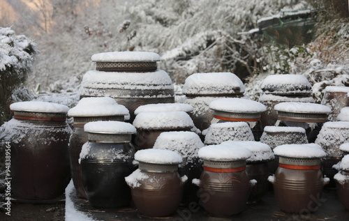 Winter view of snow covered lids of crocks at a Korean-style house near Asan-si, South Korea 