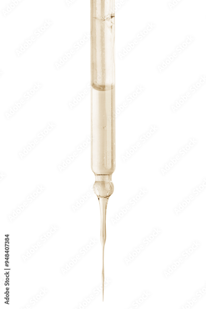 Cosmetic pipette with yellow liquid dripping. On a blank background. Acids, extract, serum, serum. Cosmetic pipette with yellow liquid dripping. On a blank background. Acids, extract, serum, serum.