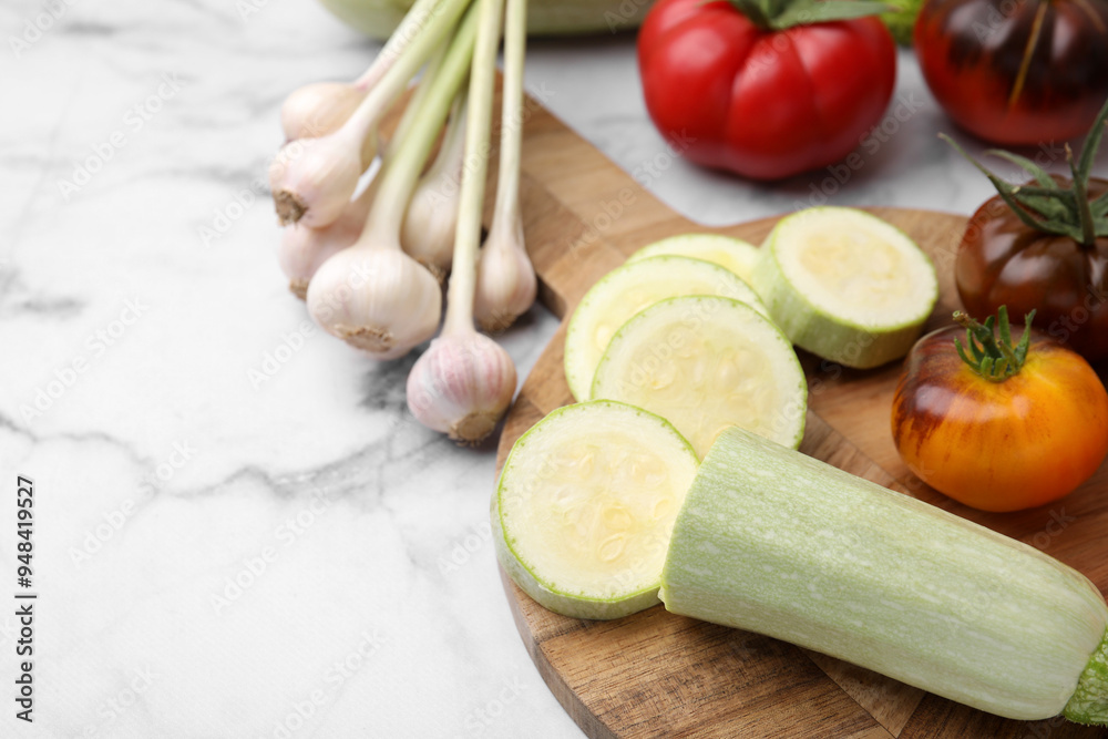 Cooking tasty stew. Different vegetables on white marble table, space for text Cooking tasty stew. Different vegetables on white marble table, space for text