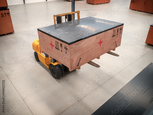 Project cargo in big wooden boxes stored in the warehouse. The cargo in wooden boxes handling by forklift. photo