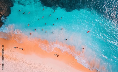 Blue ocean with sky and summer beach pictured from the air.