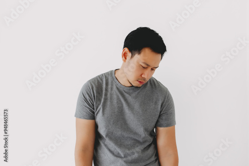 Sad asian man admit and confess his failure isolated on white. photo