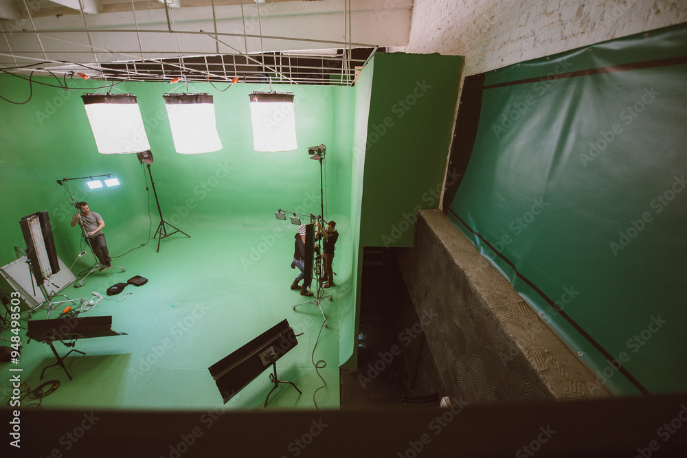 Film set, monitors and modern shooting equipment. Film crew, lighting devices, monitors, playbacks - filming equipment and a team of specialists