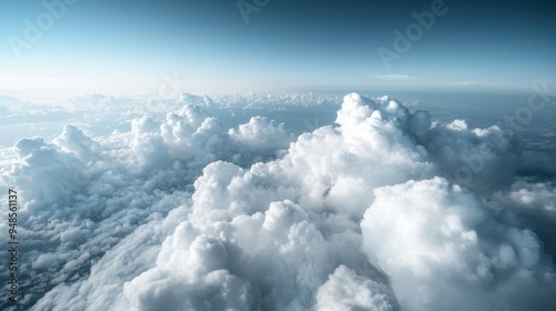 Beautiful high-altitude clouds bathed in sunlight, showcasing their fluffy nature and set against a serene clear blue sky, creating a breathtaking view from above. photo