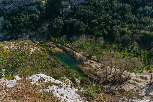 View of canyon of the Anapo valley with river at the nature reserve Pantalica with flood damage, Siracusa, Sicily, Italy
