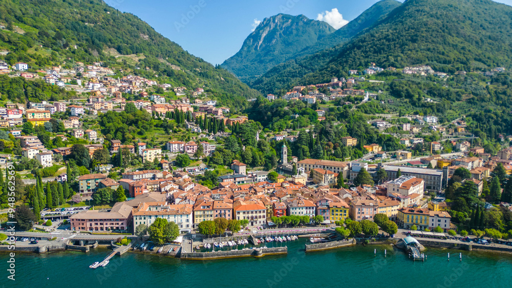 An aerial view of Bellano, a picturesque village on the eastern shore of Lake Como, Italy, captured by a drone. This charming lakeside town is known for its stunning scenery, narrow streets An aerial view of Bellano, a picturesque village on the eastern shore of Lake Como, Italy, captured by a drone. This charming lakeside town is known for its stunning scenery, narrow streets