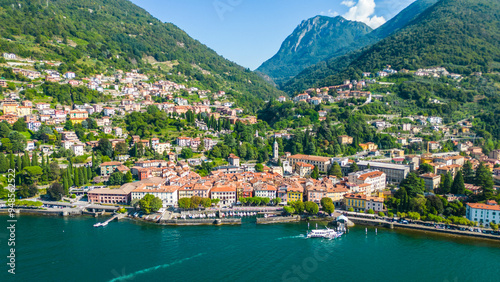 An aerial view of Bellano, a picturesque village on the eastern shore of Lake Como, Italy, captured by a drone. This charming lakeside town is known for its stunning scenery, narrow streets photo