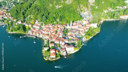 An aerial view of Varenna, a renowned tourist destination on the shores of Lake Como, Italy, captured by a drone. This famous village is celebrated for its colorful buildings, historic sites photo