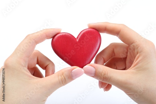 Woman holding red heart on white background, closeup