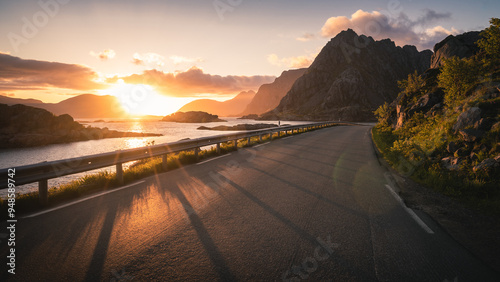 Fototapeta Naklejka Na Ścianę i Meble -  Mountain road at beautiful sunset in Lofoten Islands, Norway.
