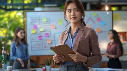 Confident Businesswoman Leading Brainstorming Session in Modern Office