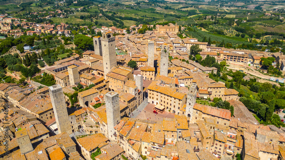 Fototapeta premium An aerial view of Certaldo, a charming medieval town in Tuscany, Italy, captured by a drone. Certaldo is known for its well-preserved historic center, characterized by ancient brick buildings