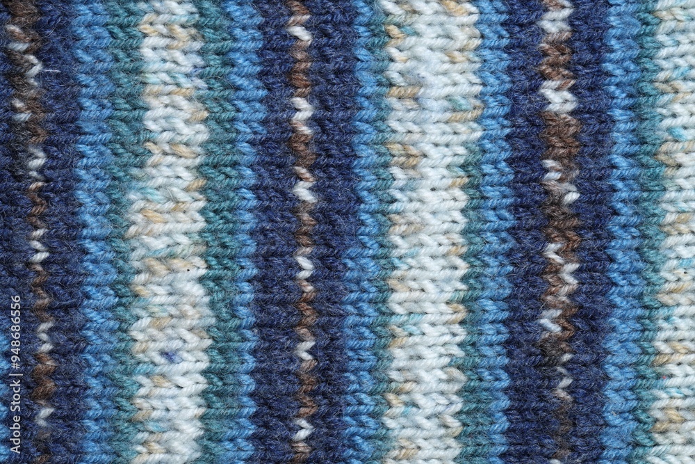 Fototapeta premium Texture of colorful knitted fabric as background, top view