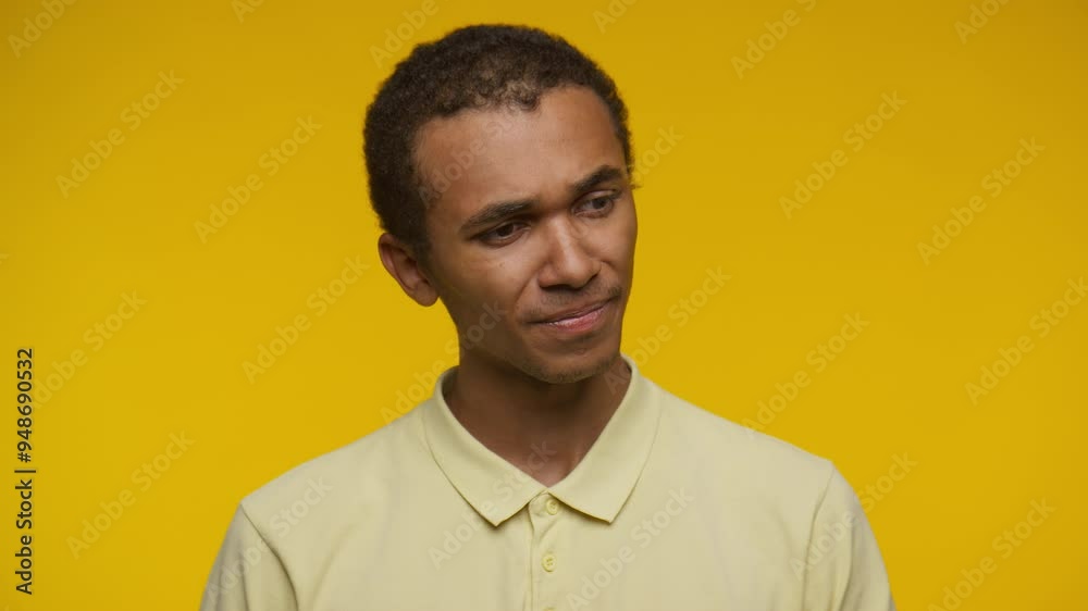 Disappointed young man with a closed eyes expression on yellow Disappointed young man with a closed eyes expression on yellow