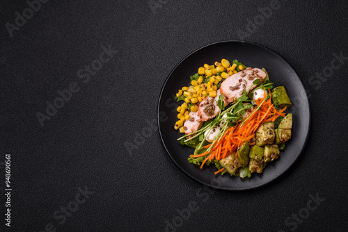 Fresh juicy salad with meat, mozzarella, carrots, lettuce, corn