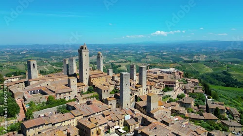 An aerial view of Certaldo, a charming medieval town in Tuscany, Italy, captured by a drone. Certaldo is known for its well-preserved historic center, characterized by ancient brick buildings