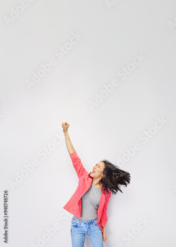 Photo of young attractive asian woman scream wear trendypink suit fists up hooray celebrate - isolated on grey background. photo