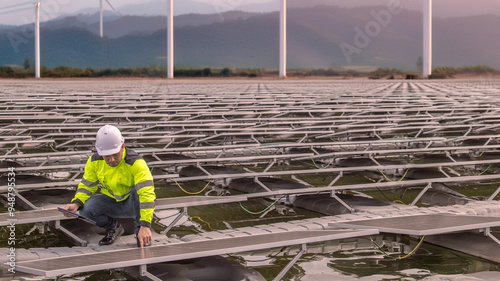 Engineer working at floating solar farm,checking and maintenance with solar batteries near solar panels,supervisor Check the system at the solar power station