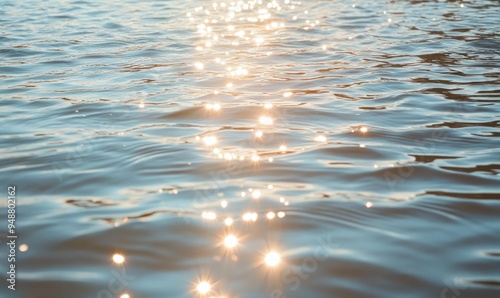 Fototapeta Naklejka Na Ścianę i Meble -  Close-up of small waves in a lake, sunlight sparkling on the water